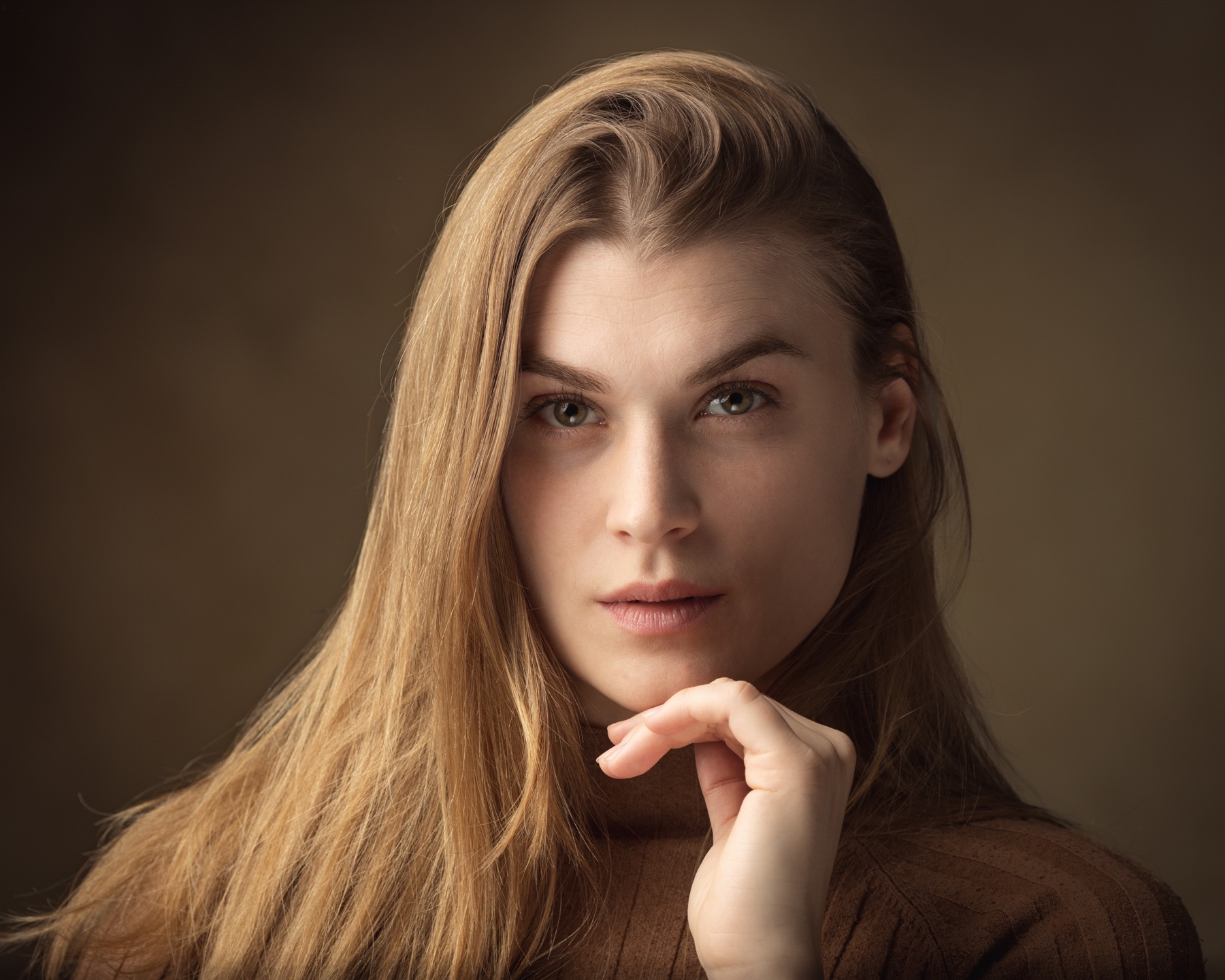 Natural actor headshot of a woman with long hair
