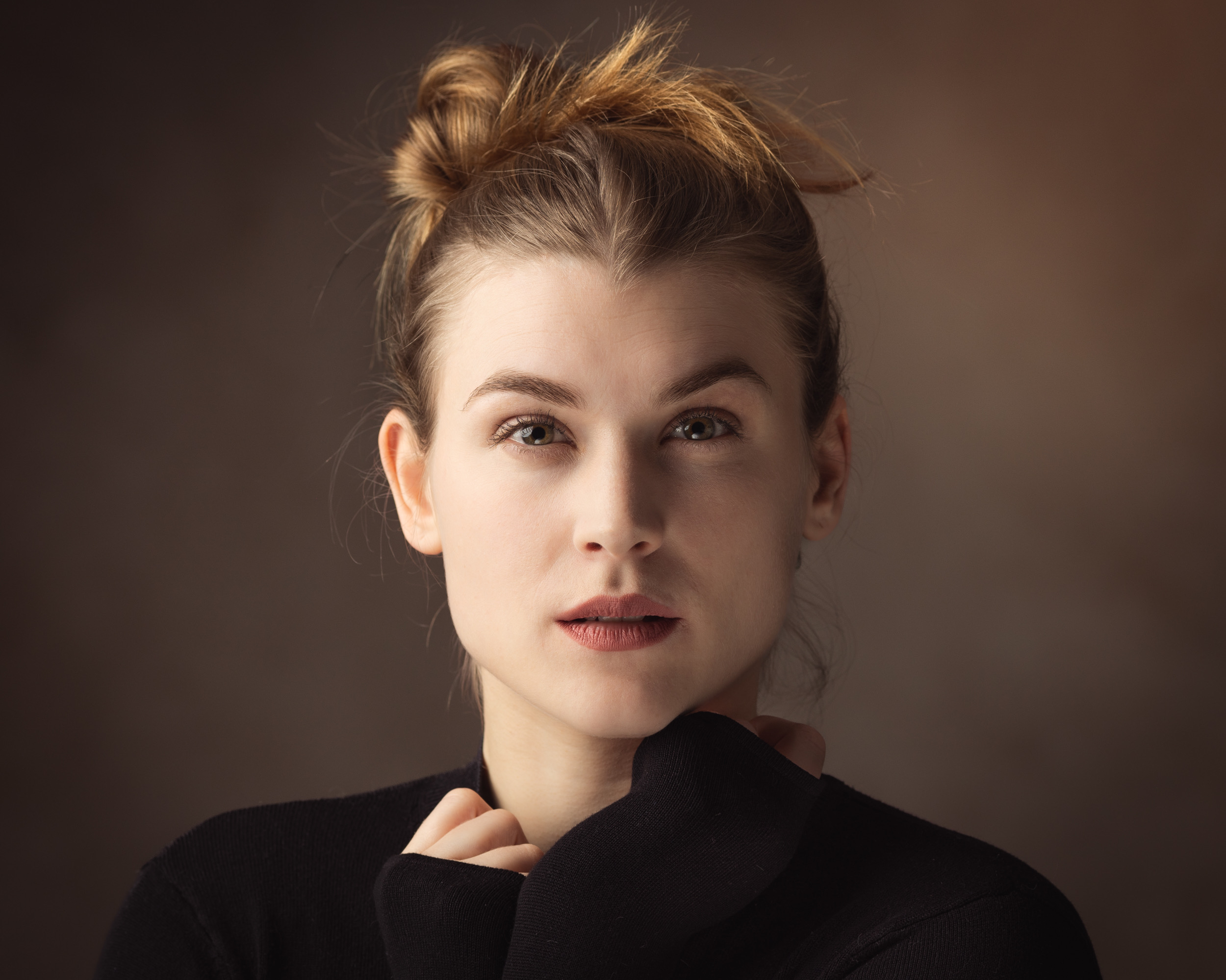 Natural actor headshot of a woman with her hair up