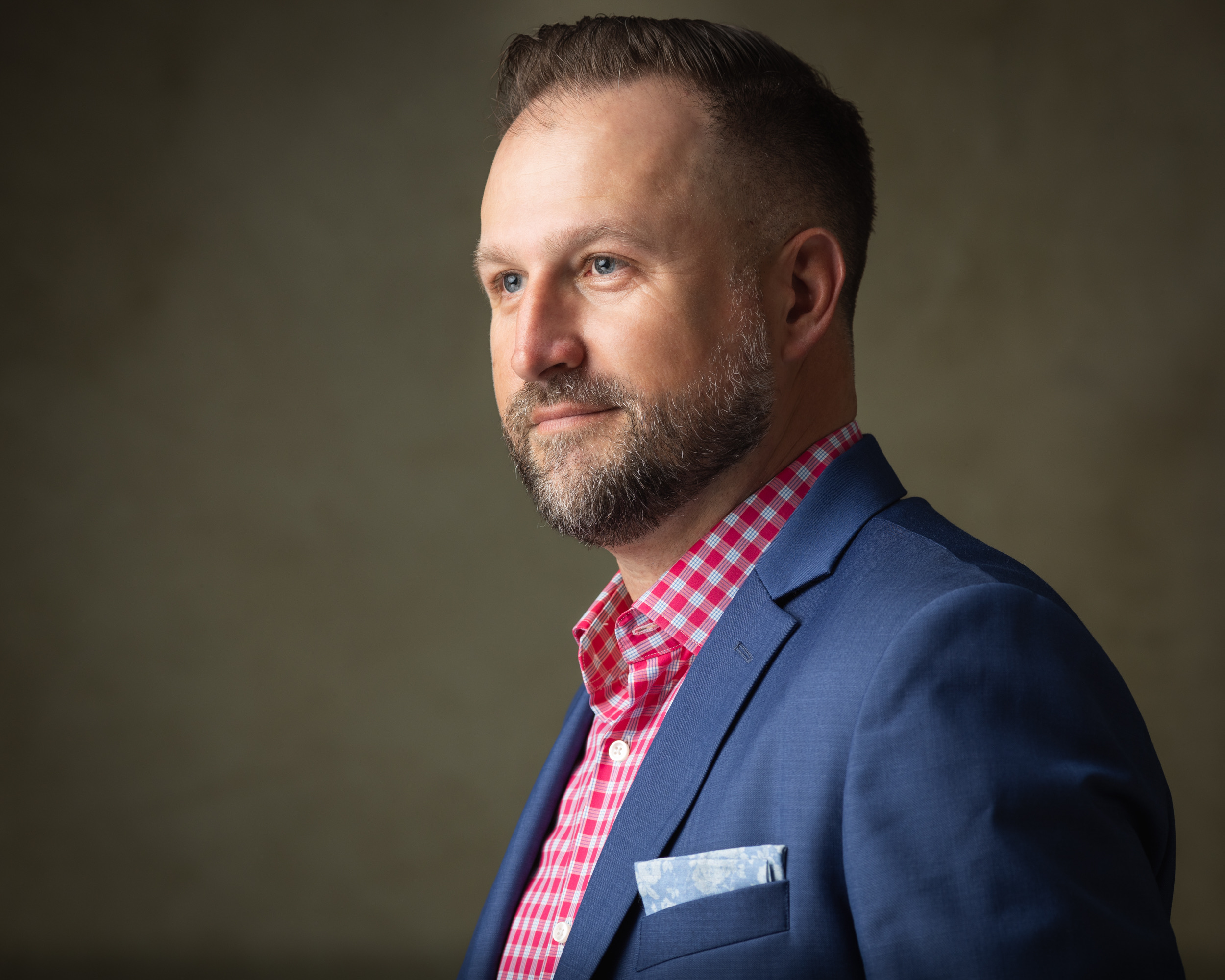 Corporate portrait of a man in a blue blazer