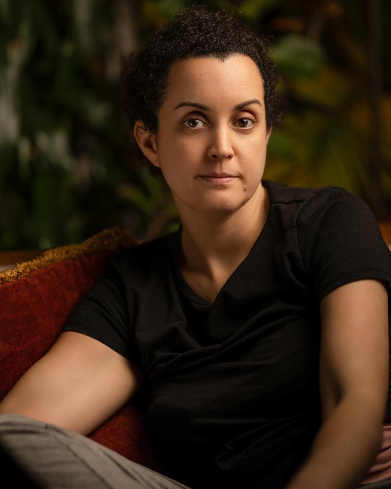 Woman seated in a relaxed environmental portrait